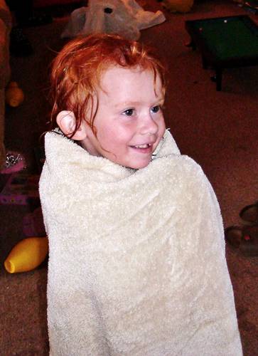 Sophie is such a happy little girl Sophie wrapped in a towel
